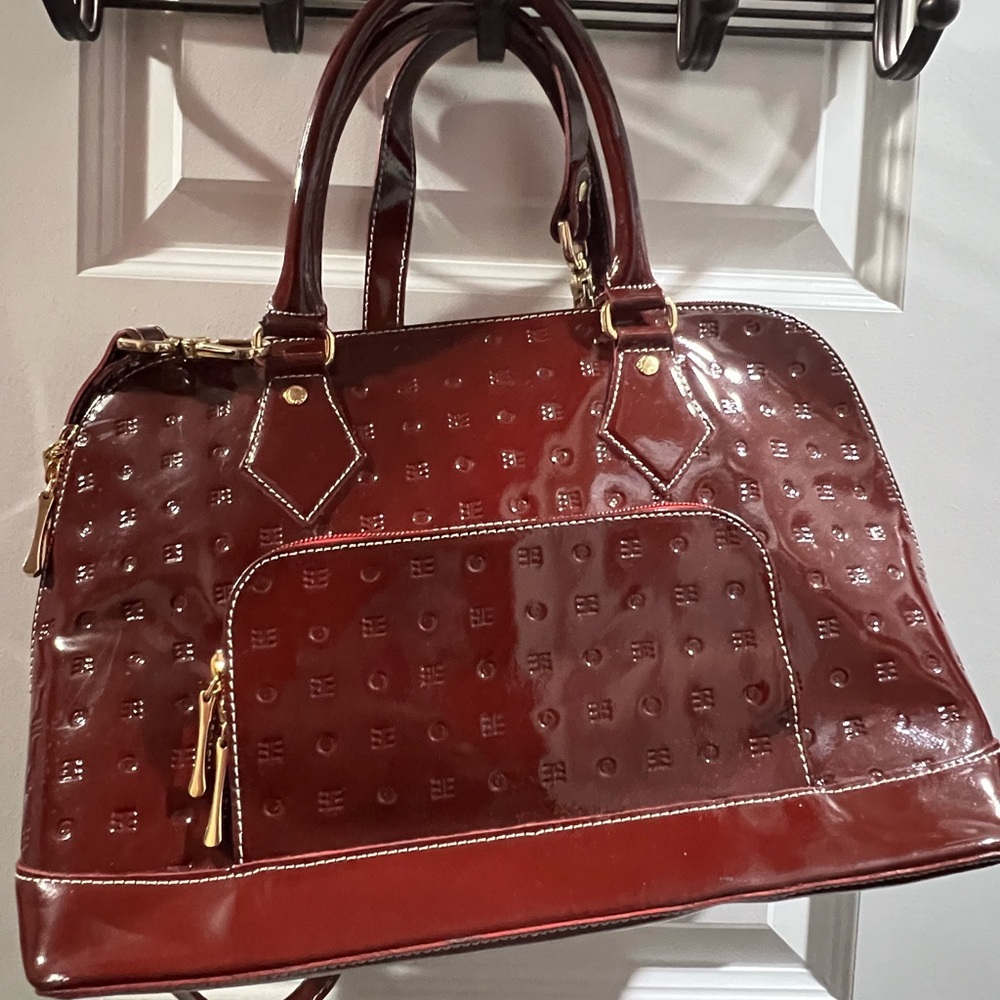 Arcadia burgundy bag . 8 inches Height X 14 inches in Width.